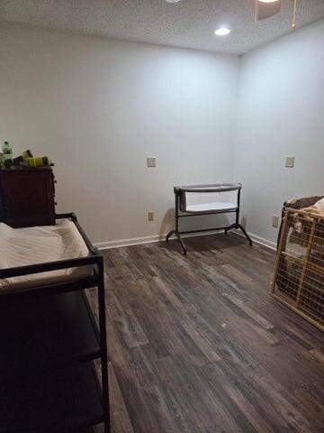 2596 Keith Valley Road Southeast Cleveland, TN 37323 - Photo 19 of 24 a room with a wooden floor and a chair