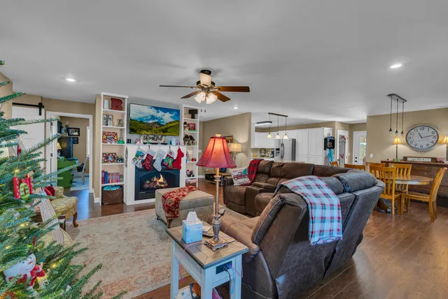 a living room filled with furniture and a chandelier