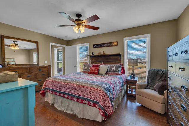 a bedroom with a bed and a chandelier