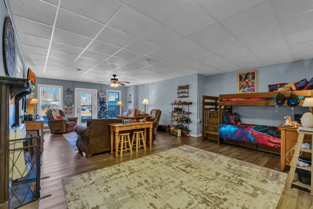 a living room with lots of furniture and a flat screen tv