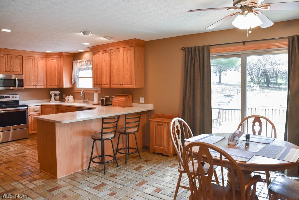 6955 Taylor Road Clinton, OH 44216 - Photo 8 of 26 Open kitchen and dining room.