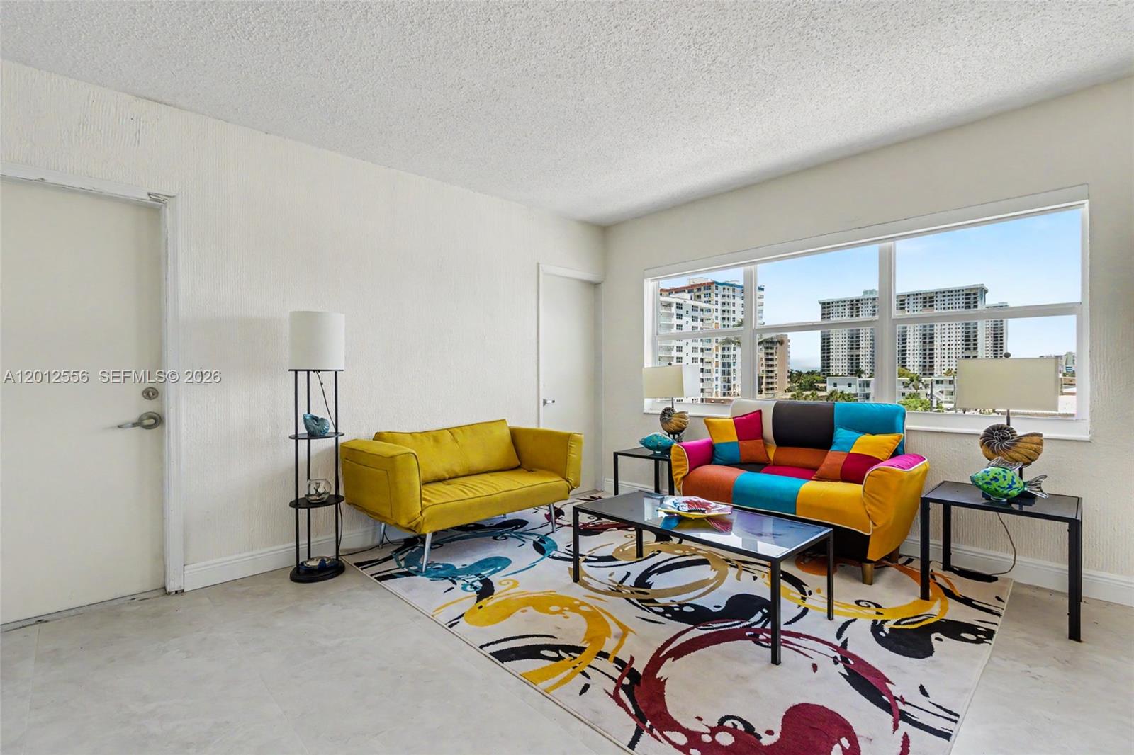 1801 South Surf Road, Unit 4A Hollywood, FL 33019 - Photo 14 of 24 a living room with furniture and a rug