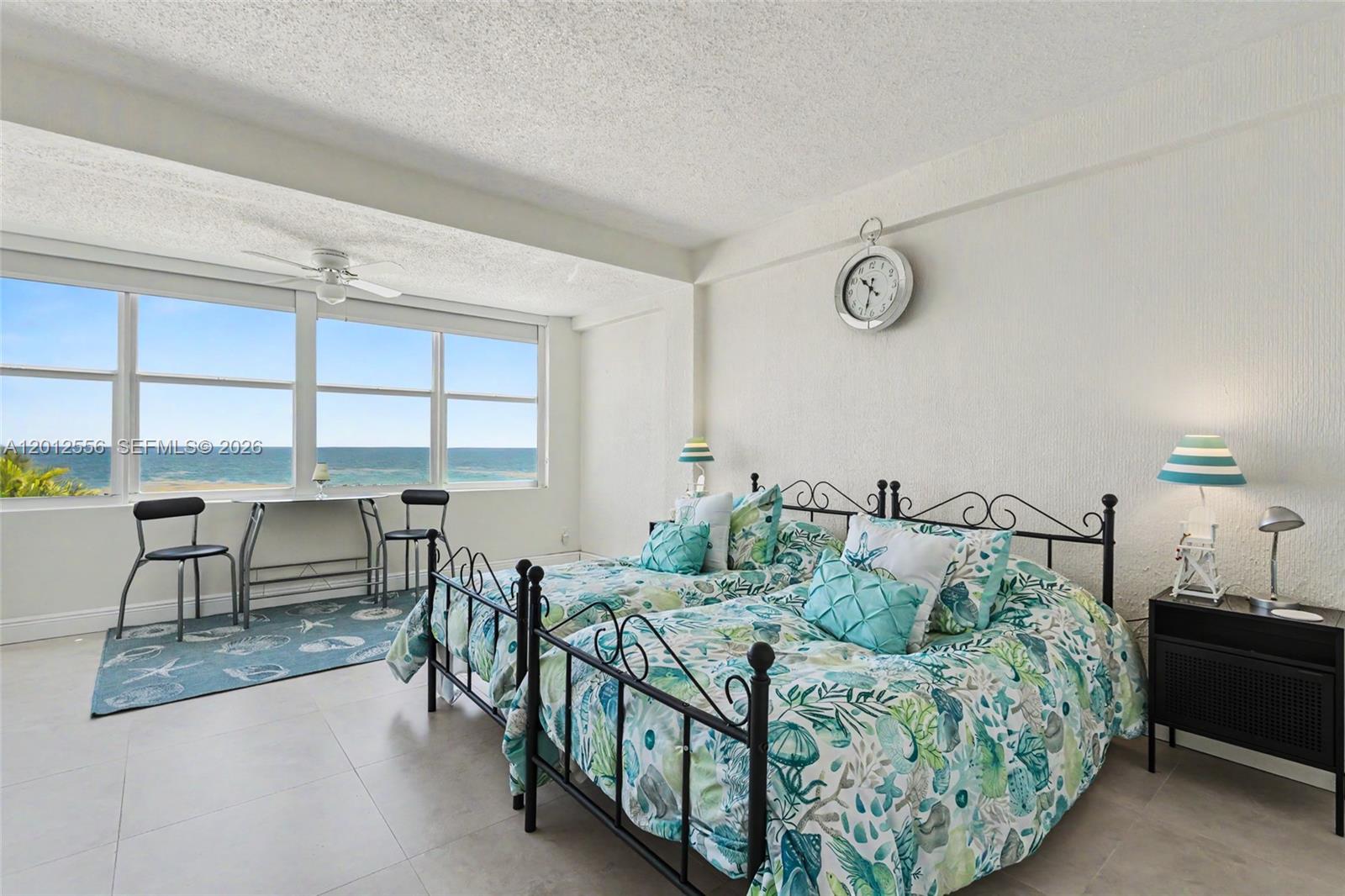 1801 South Surf Road, Unit 4A Hollywood, FL 33019 - Photo 19 of 24 a bed sitting in a bedroom next to a window