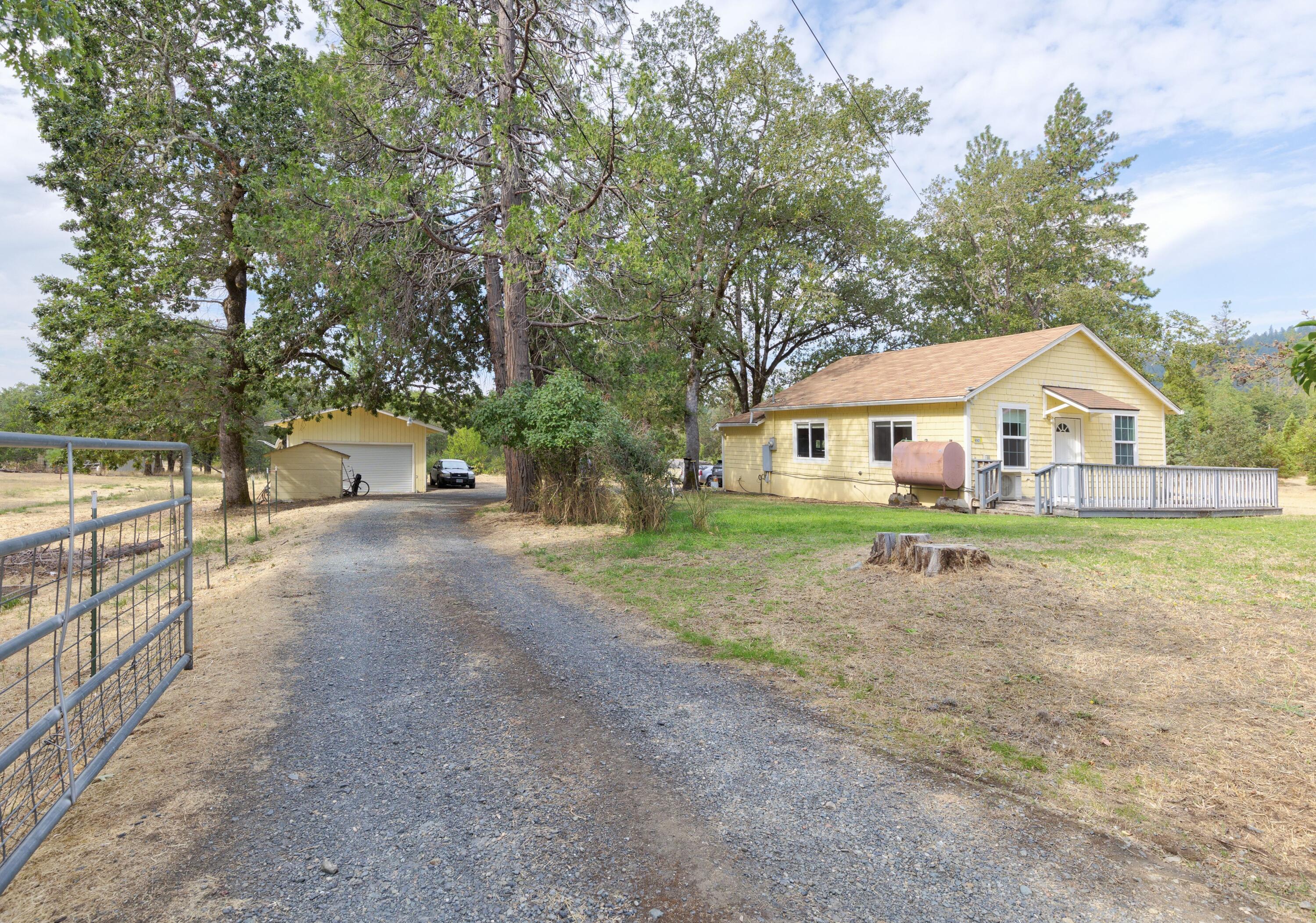6901 Tunnel Loop Road Grants Pass, OR 97526 - Photo 4 of 18 a view of house with outdoor space and tree s