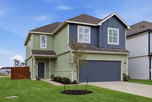 a brick house with a yard