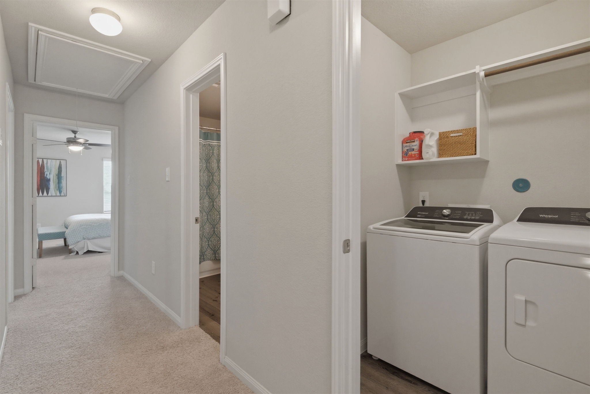 2542 Sturgeon Way Conroe, TX 77384 - Photo 16 of 40 a room that has a washer and dryer with wooden floor