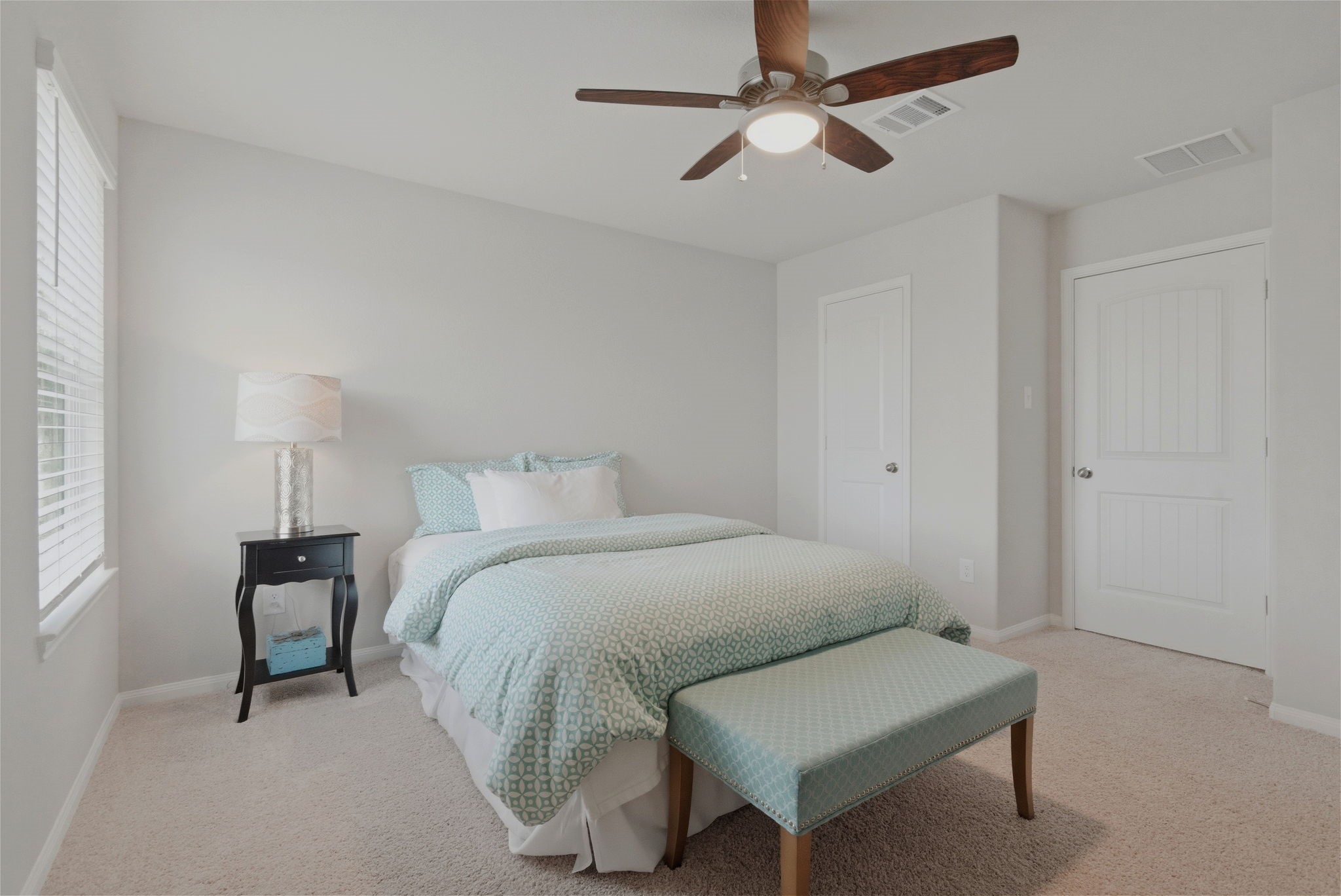 2542 Sturgeon Way Conroe, TX 77384 - Photo 18 of 40 a spacious bedroom with a bed and a chandelier
