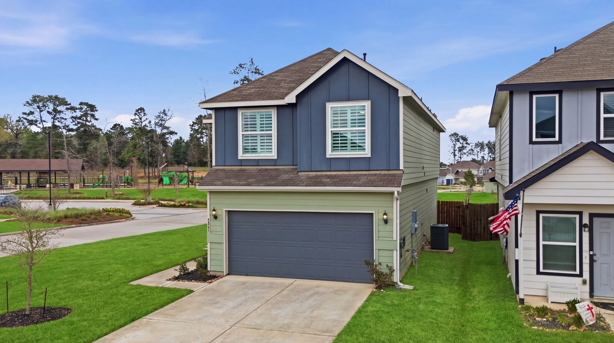 2542 Sturgeon Way Conroe, TX 77384 - Photo 2 of 40 a front view of a house with a yard