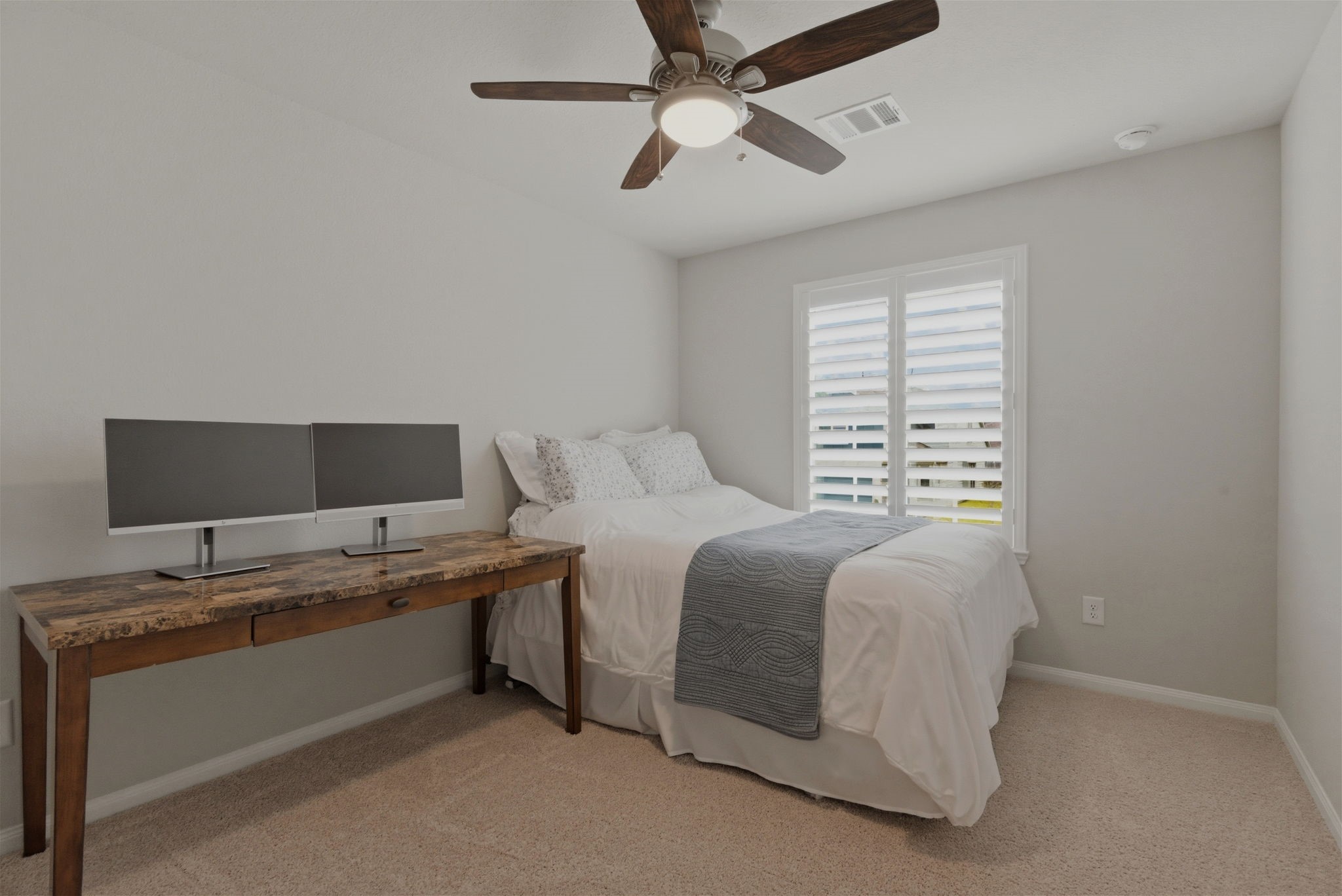 2542 Sturgeon Way Conroe, TX 77384 - Photo 21 of 40 a bedroom with a bed and a window