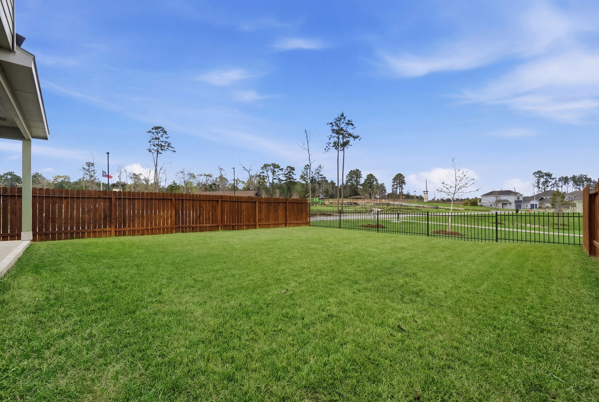 2542 Sturgeon Way Conroe, TX 77384 - Photo 32 of 40 a view of a golf course with a lake