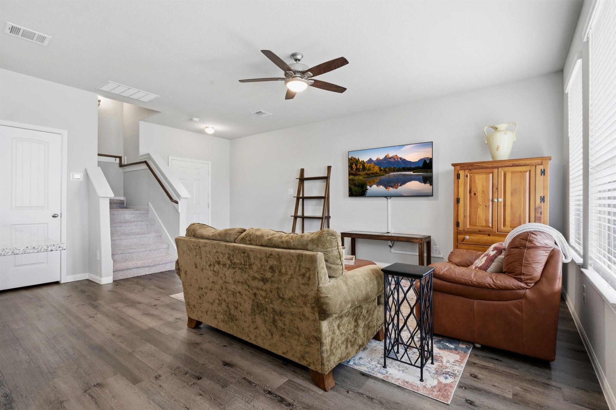 2542 Sturgeon Way Conroe, TX 77384 - Photo 4 of 40 a living room with furniture and a ceiling fan