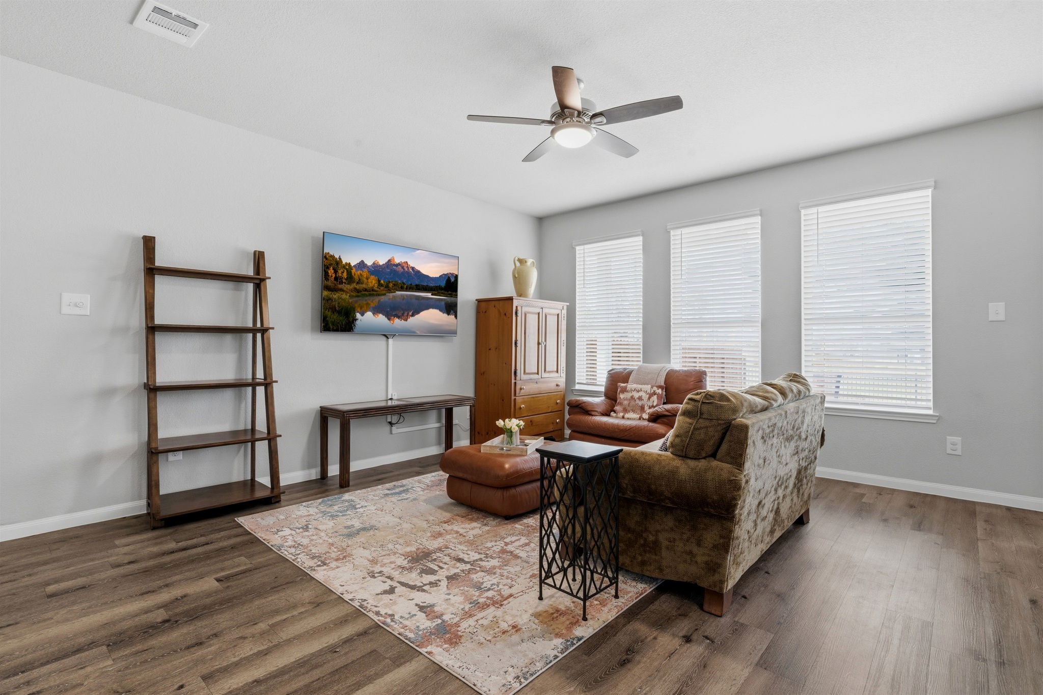 2542 Sturgeon Way Conroe, TX 77384 - Photo 6 of 40 a living room with furniture and a flat screen tv