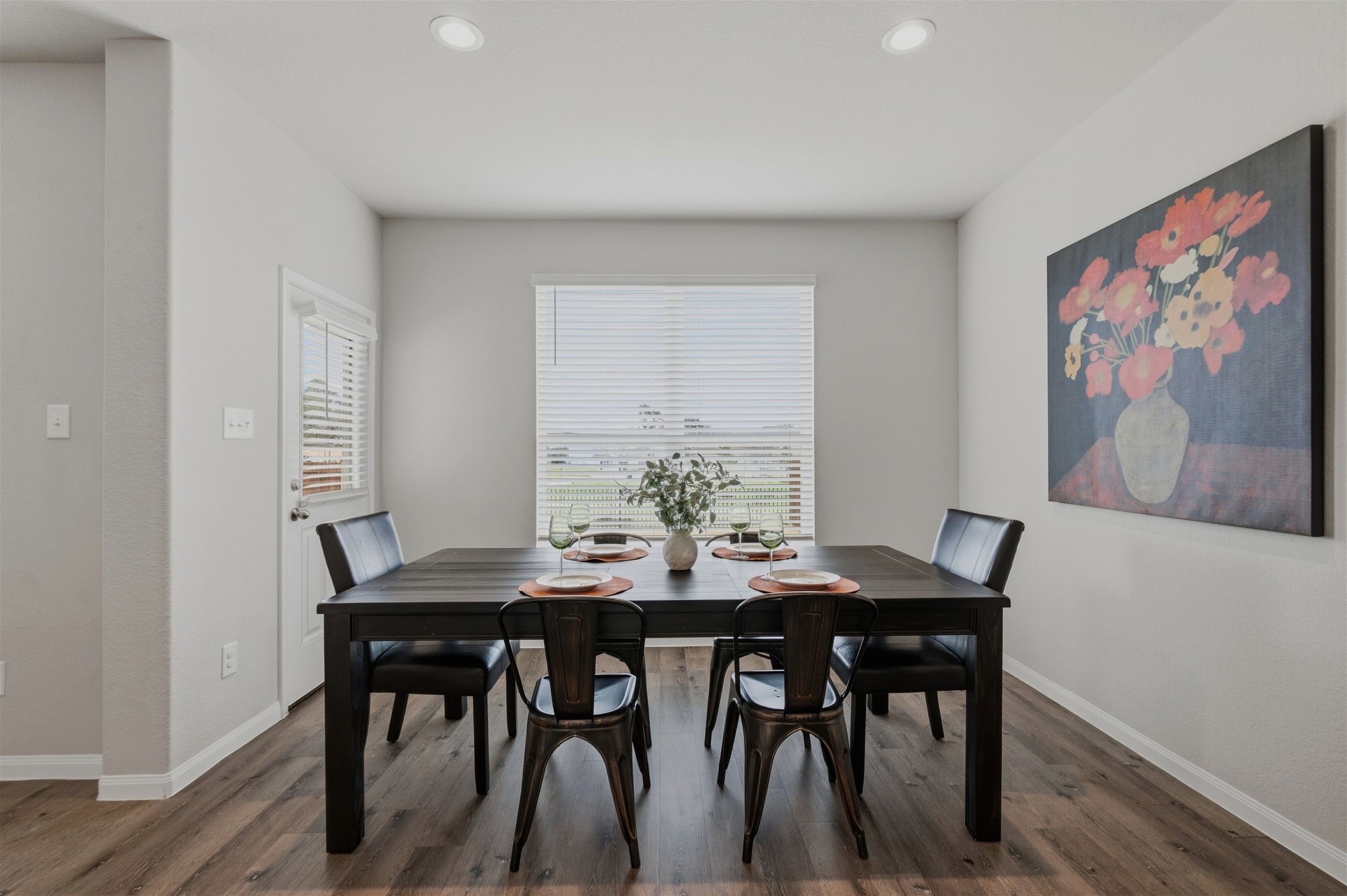 2542 Sturgeon Way Conroe, TX 77384 - Photo 10 of 40 a view of a dining room with furniture and wooden floor