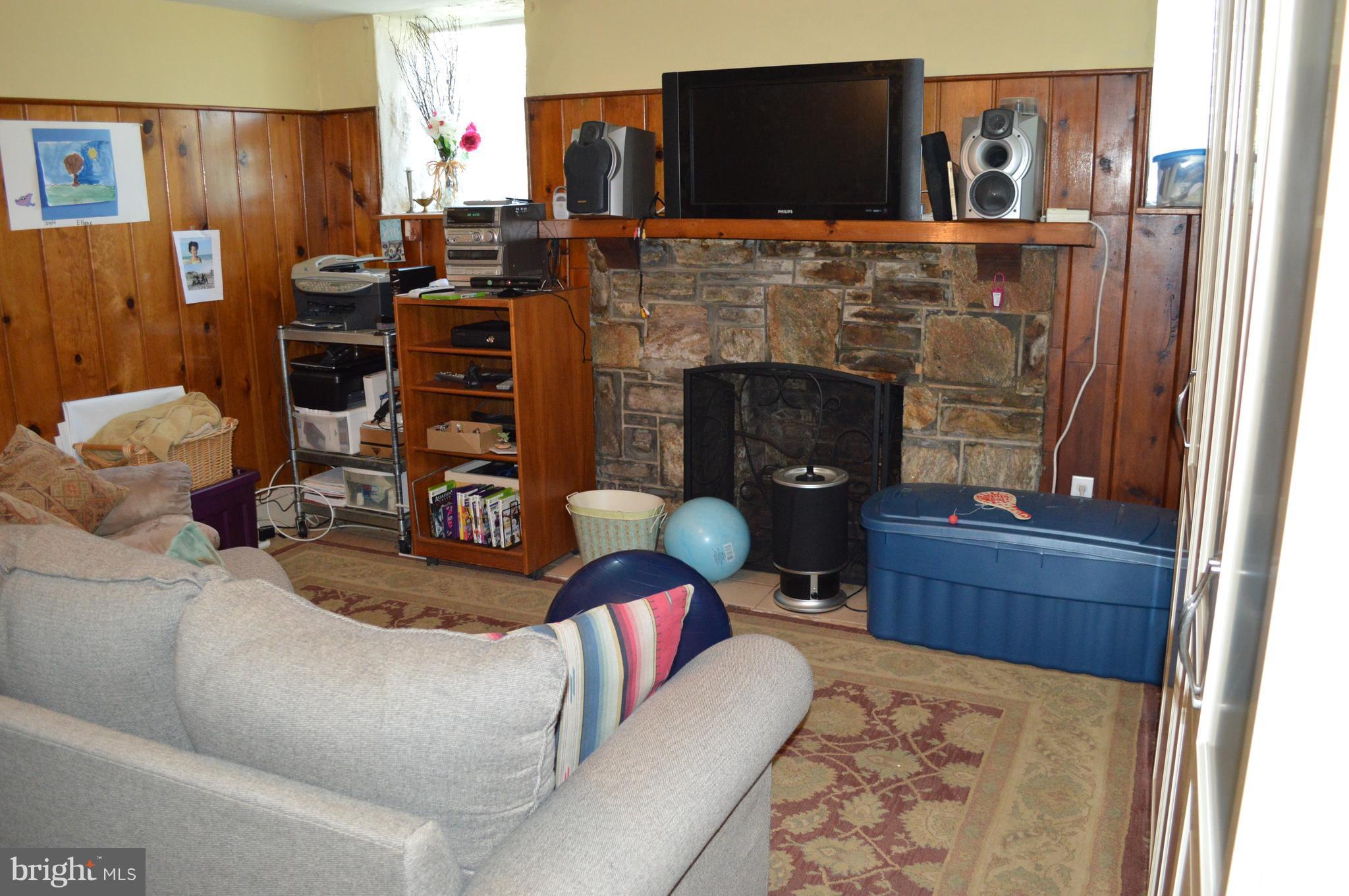 3722 Delverne Road Baltimore, MD 21218 - Photo 10 of 29 a living room with furniture and a fireplace
