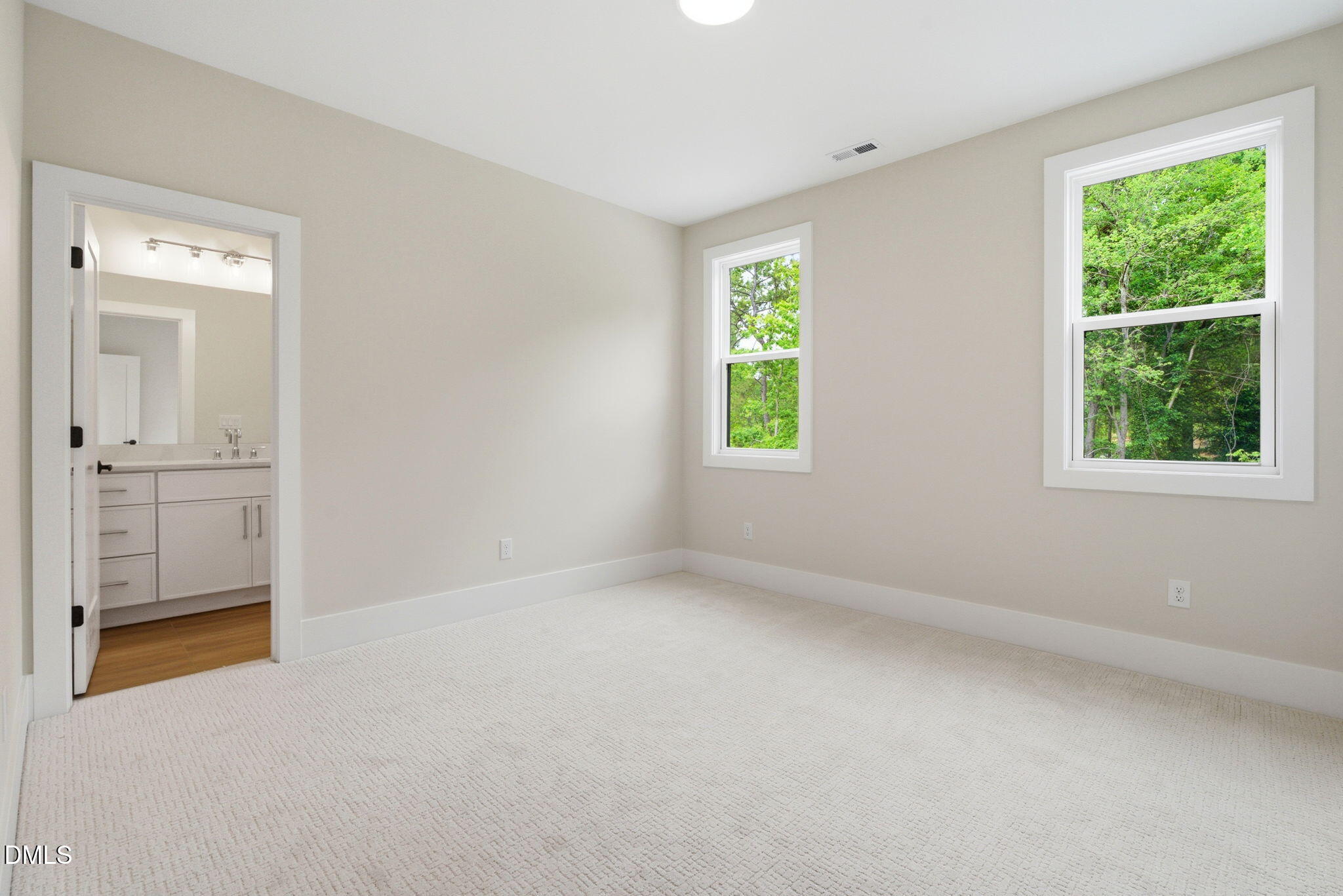 1304 Sanctuary Pond Drive Raleigh, NC 27606 - Photo 32 of 52 an empty room with windows