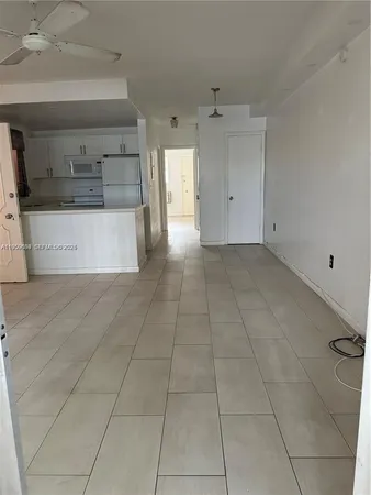 a view of a kitchen with an empty space