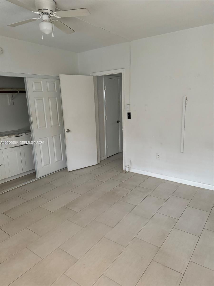 285 Northeast 191st Street, Unit 2907 Miami, FL 33179 - Photo 8 of 13 a view of an empty room