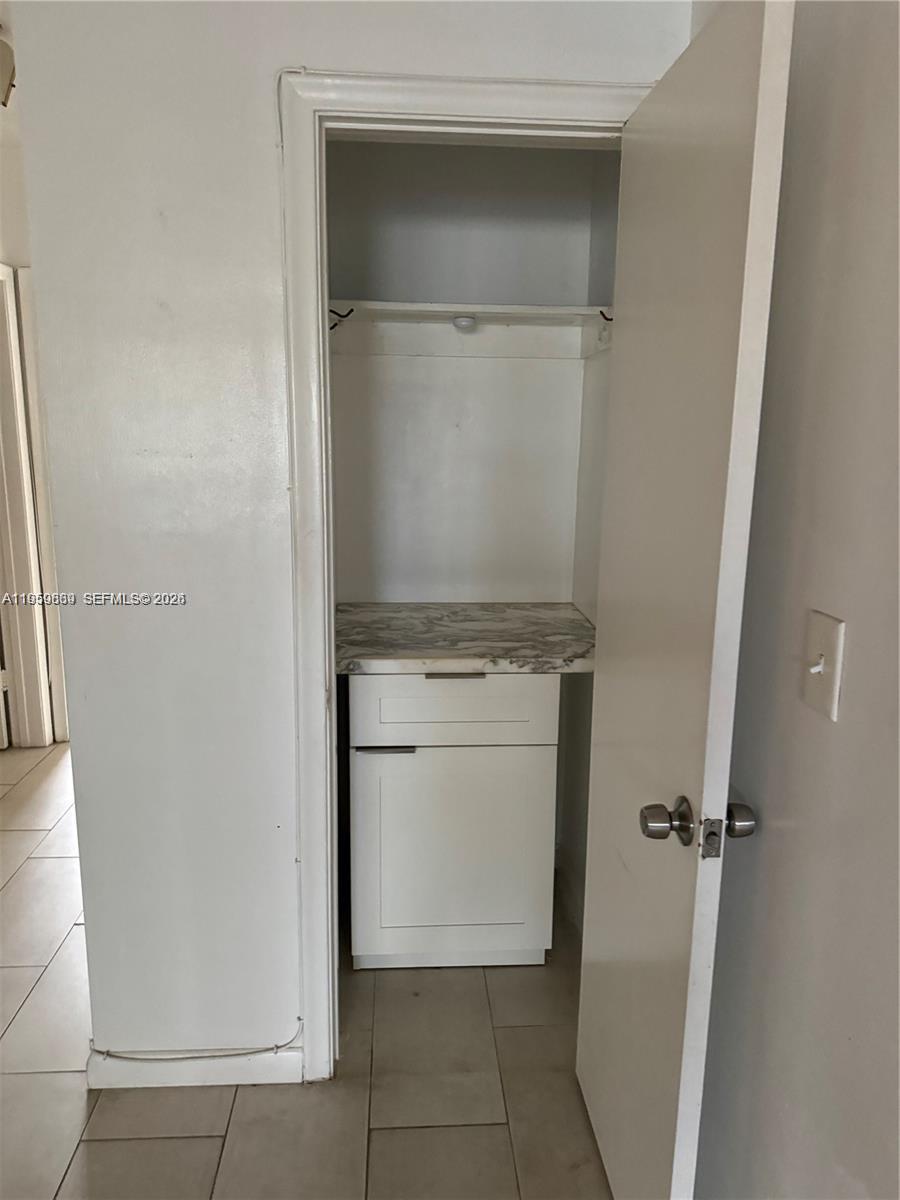 285 Northeast 191st Street, Unit 2907 Miami, FL 33179 - Photo 10 of 13 a view of a storage & utility room