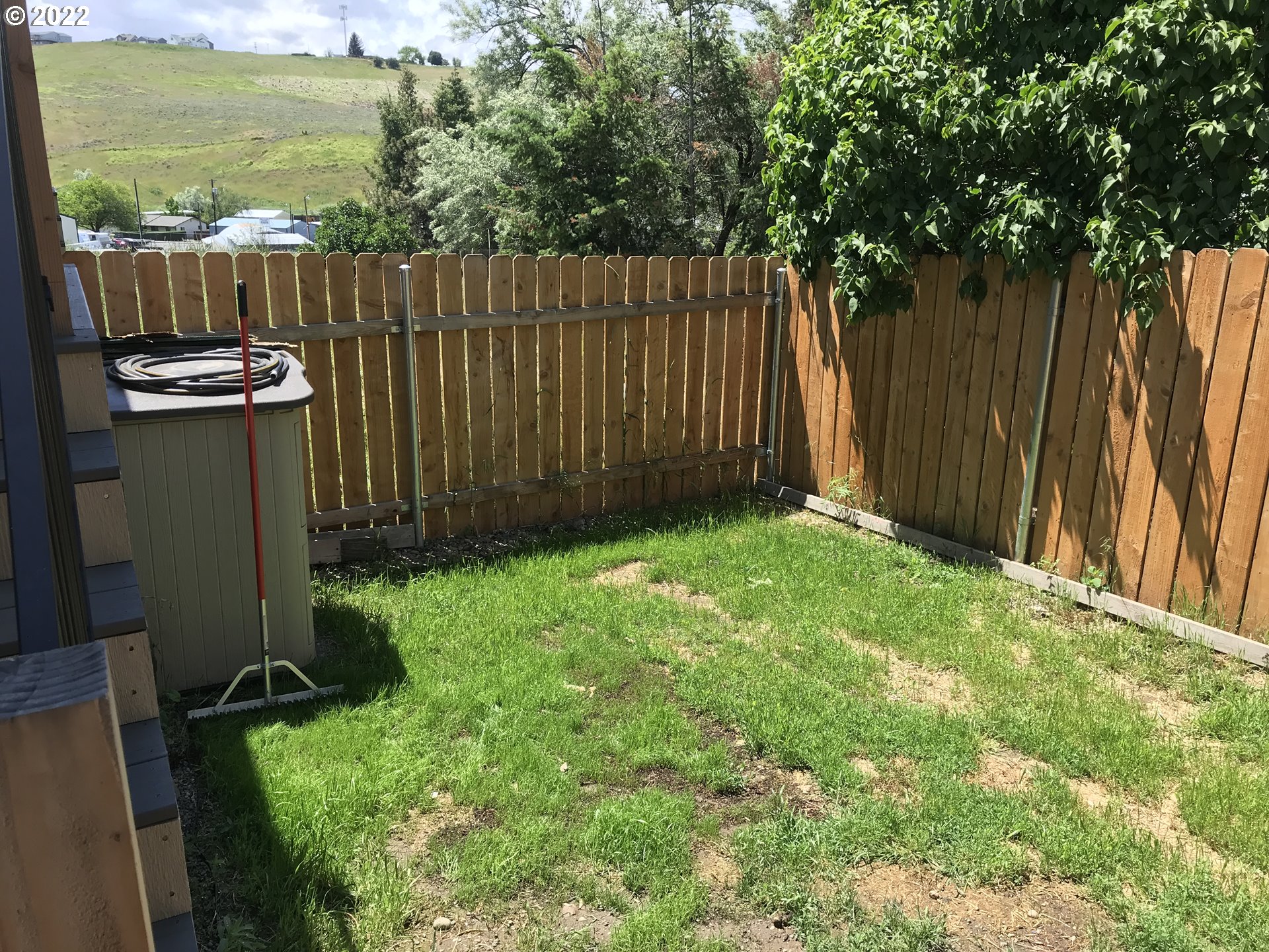 1239 Southwest 12th Street Pendleton, OR 97801 - Photo 12 of 12 a backyard of a house with lots of green space