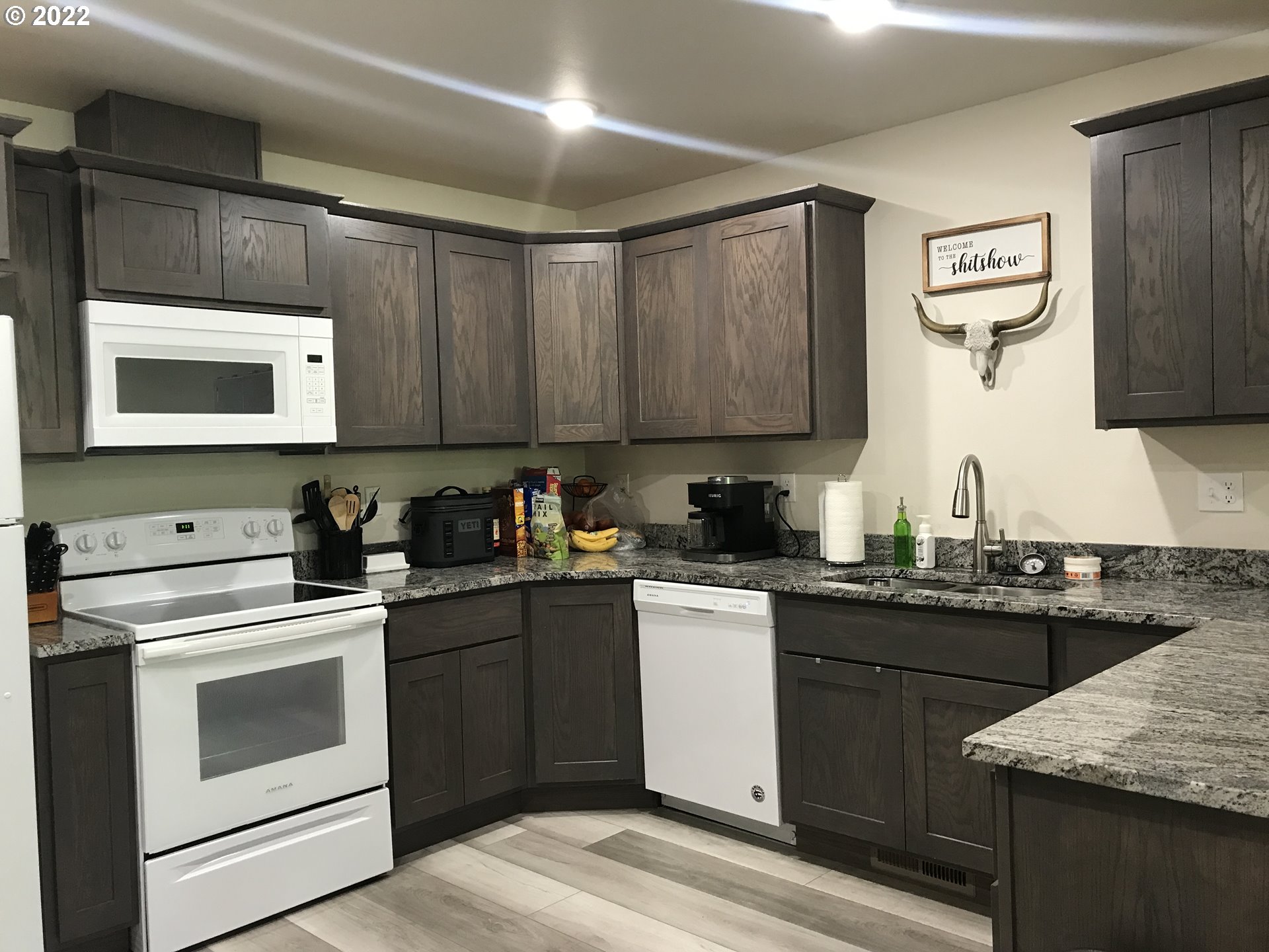 1239 Southwest 12th Street Pendleton, OR 97801 - Photo 2 of 12 a kitchen with a sink stove and microwave