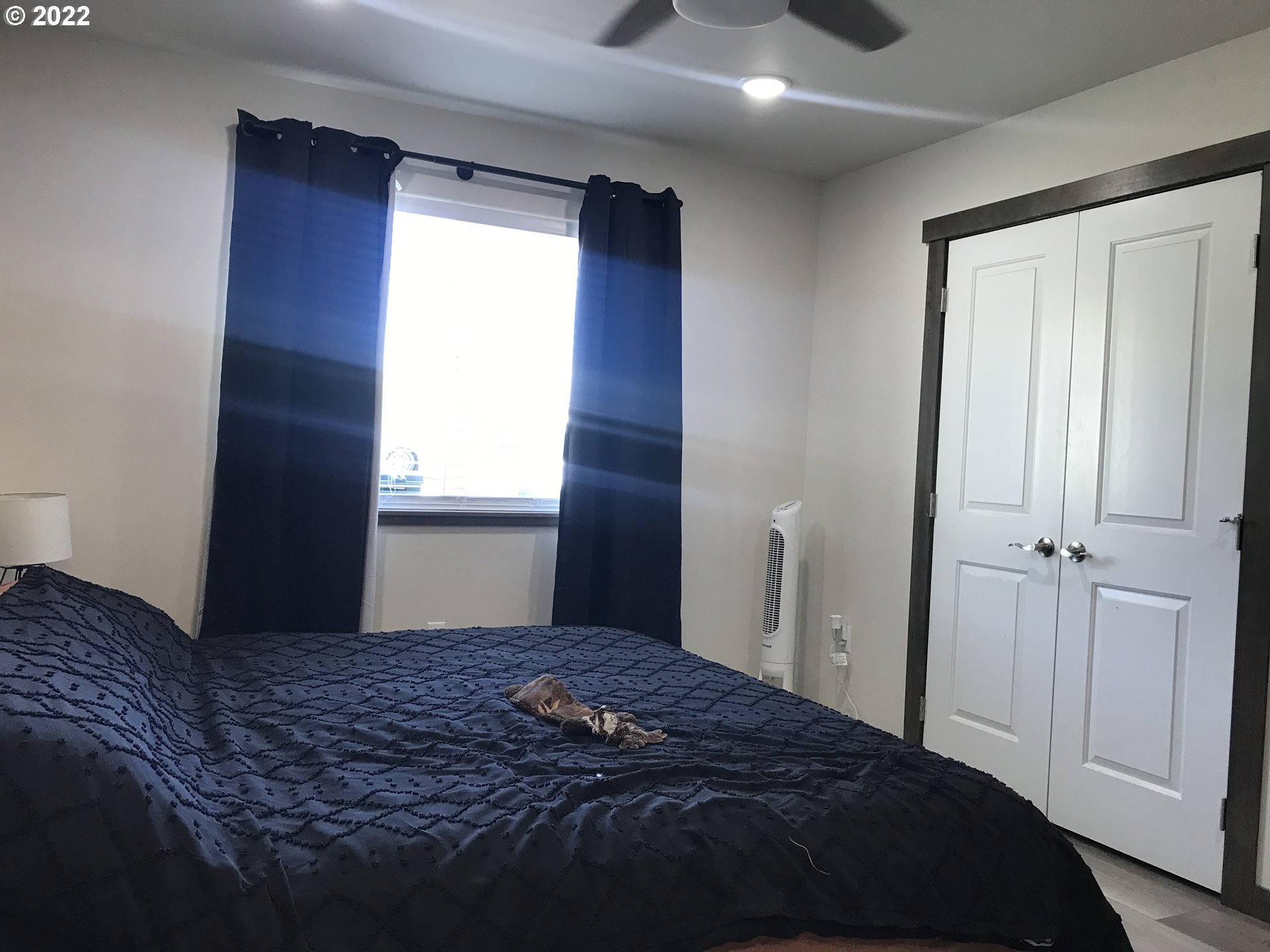 1239 Southwest 12th Street Pendleton, OR 97801 - Photo 5 of 12 a bedroom with a bed and a window