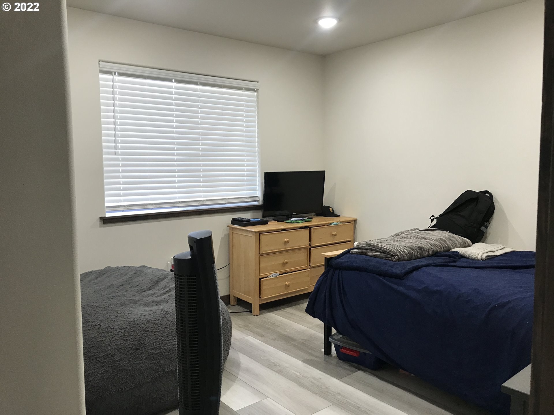 1239 Southwest 12th Street Pendleton, OR 97801 - Photo 6 of 12 a bedroom with a bed and flat screen tv