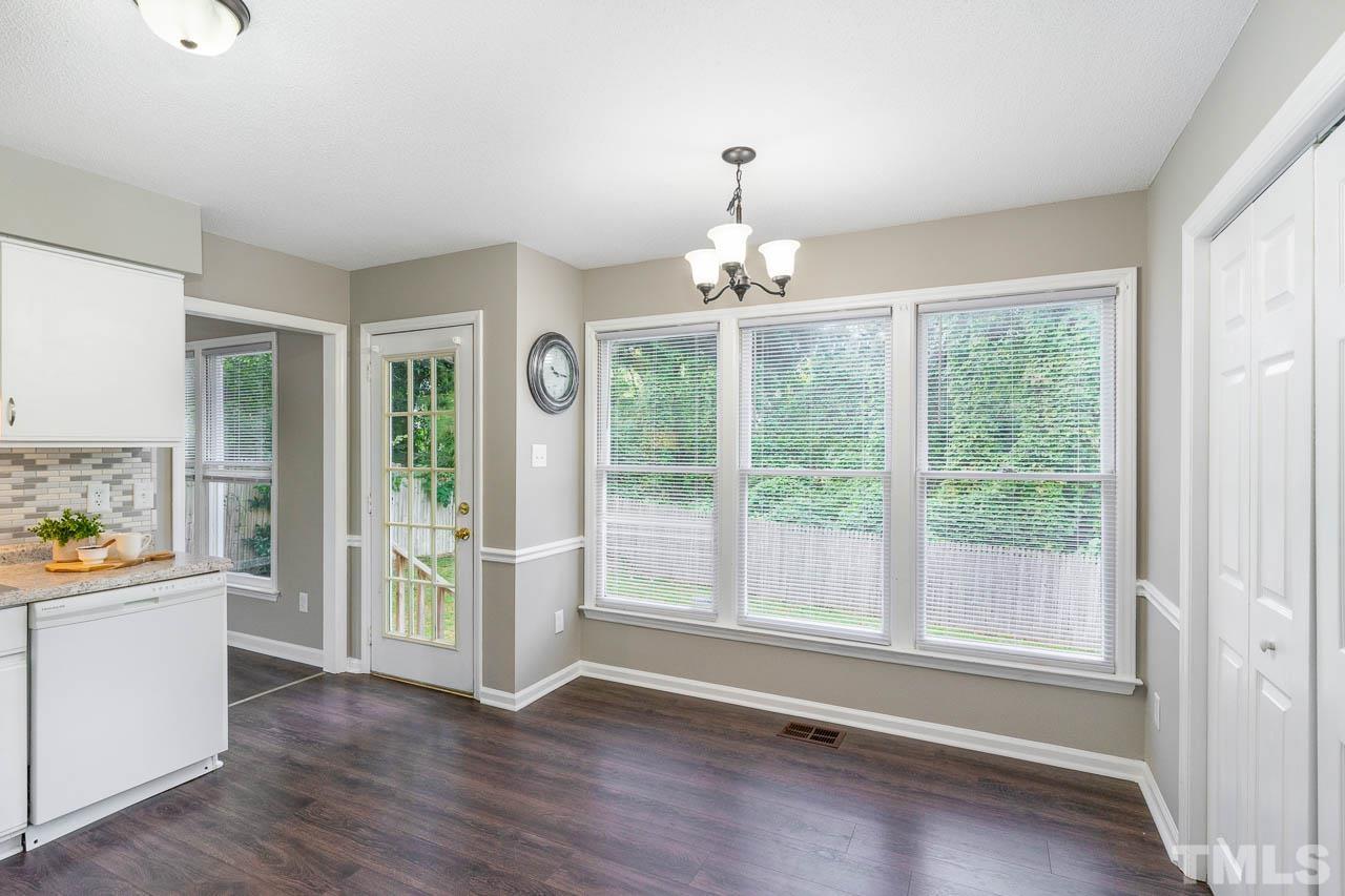 4209 Traders Dock Court Raleigh, NC 27616 - Photo 6 of 17 a view of an empty room with a window and wooden floor