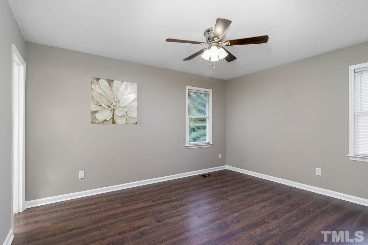4209 Traders Dock Court Raleigh, NC 27616 - Photo 8 of 17 a view of wooden floor and windows in a room