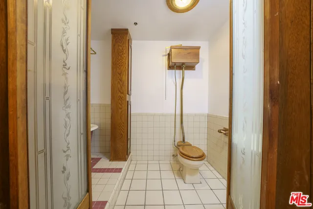 a bathroom with a shower and a toilet