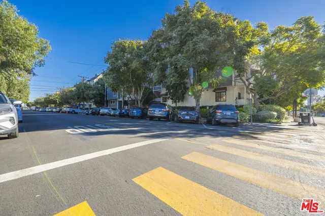 a view of street with parked cars