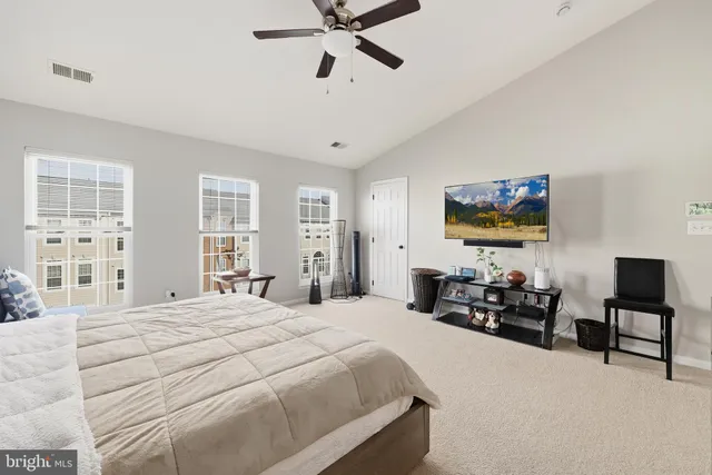 a bedroom with a bed furniture and a window