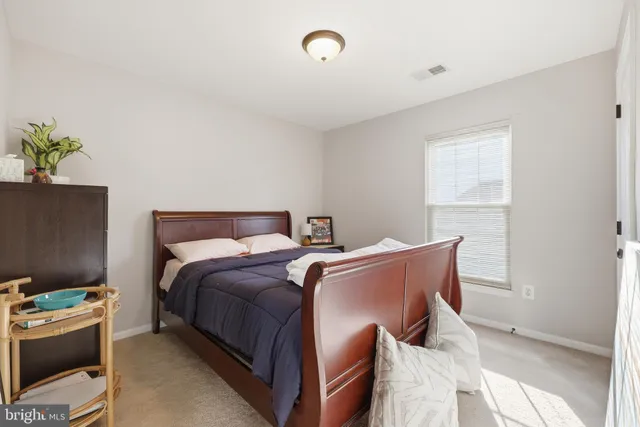 a bed room with a bed and a couch