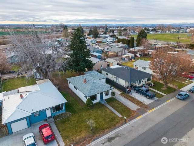 an aerial view of residential houses with outdoor space