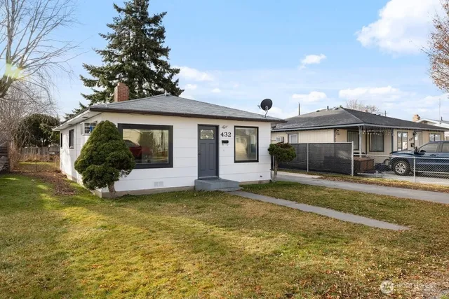 a view of a house with a garden and yard