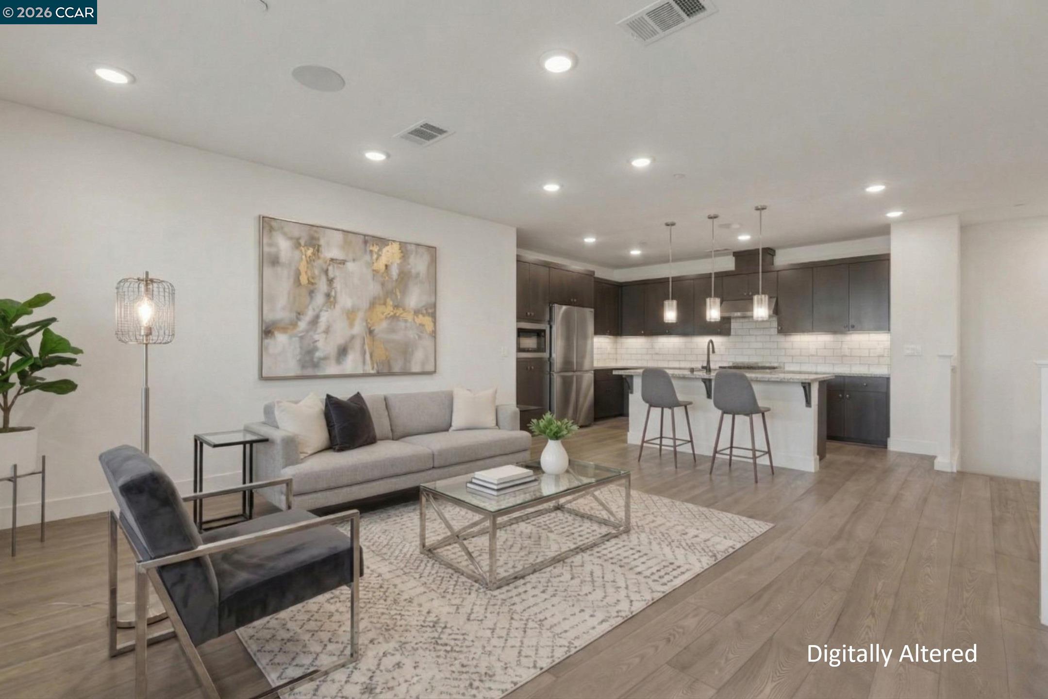 2737 5th Street Alameda, CA 94501 - Photo 13 of 37 a living room with furniture and kitchen view