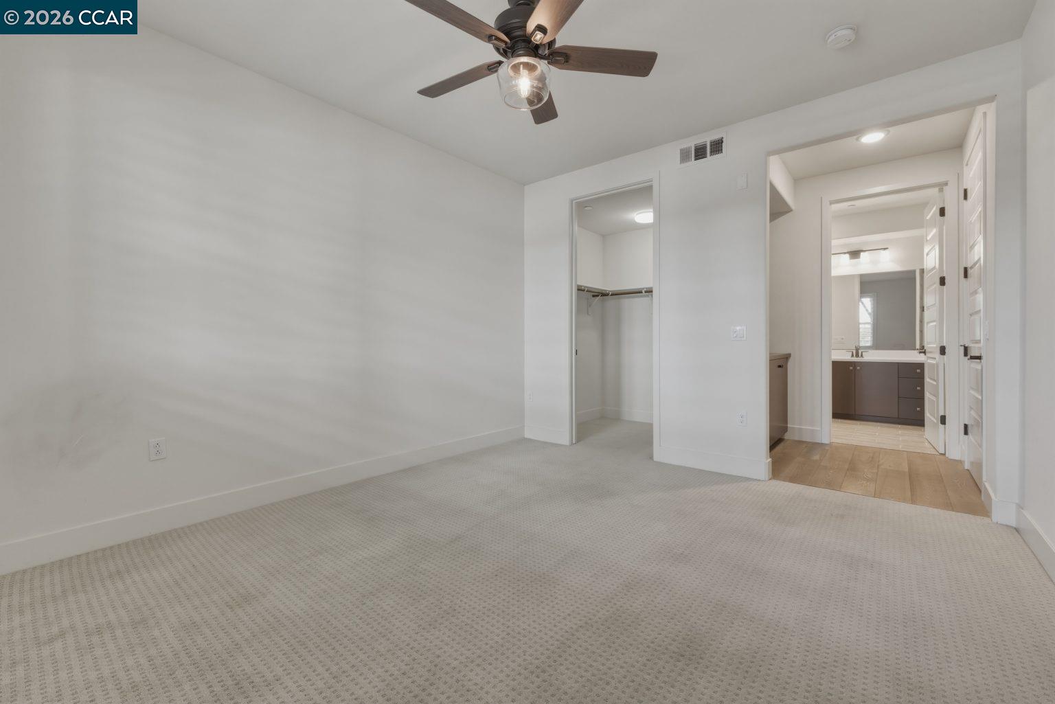 2737 5th Street Alameda, CA 94501 - Photo 17 of 37 an empty room with fan and entrance