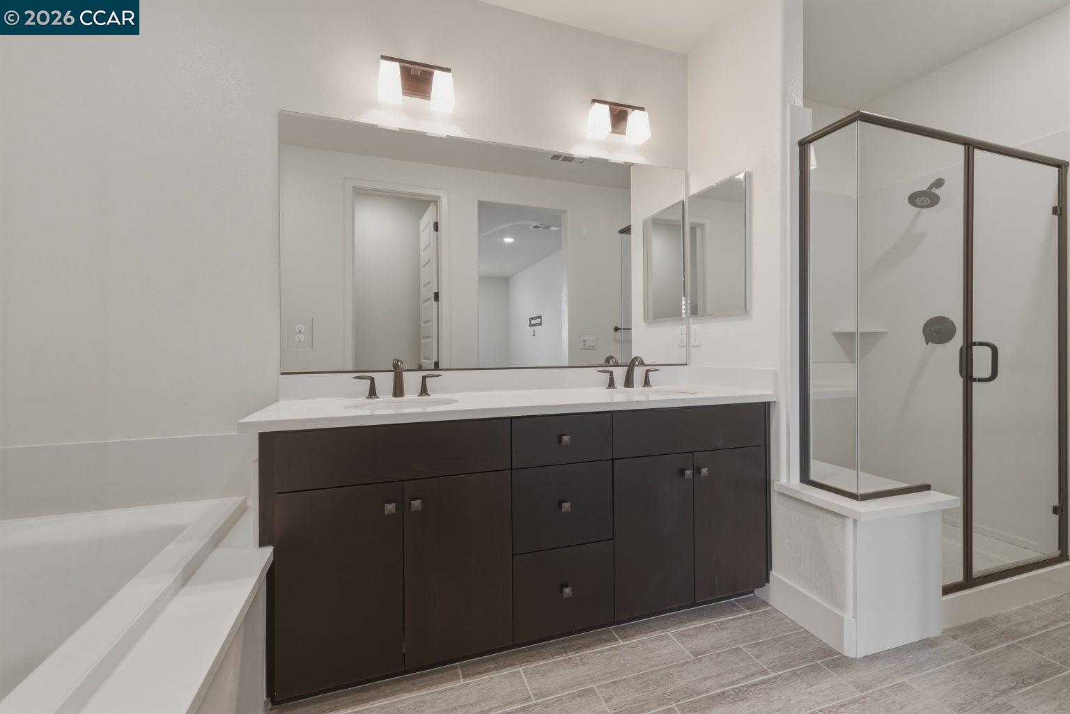 2737 5th Street Alameda, CA 94501 - Photo 18 of 37 a bathroom with a double vanity sink mirror and double