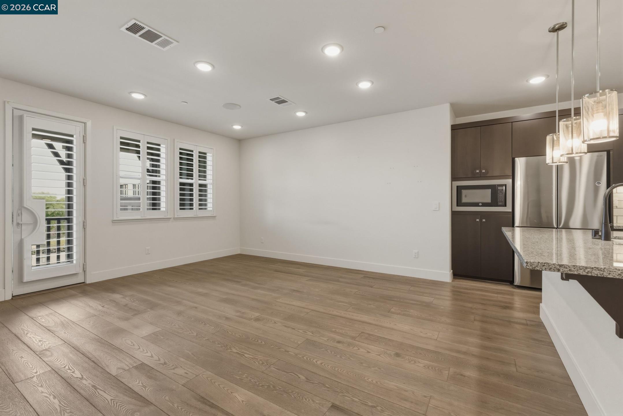 2737 5th Street Alameda, CA 94501 - Photo 2 of 37 a view of kitchen with stainless steel appliances a refrigerator and a stove top oven