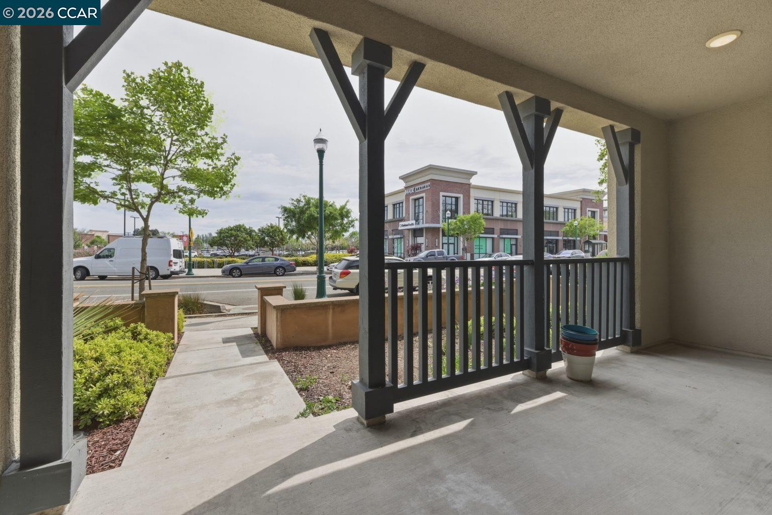2737 5th Street Alameda, CA 94501 - Photo 28 of 37 a view of a porch with potted plants and a large tree