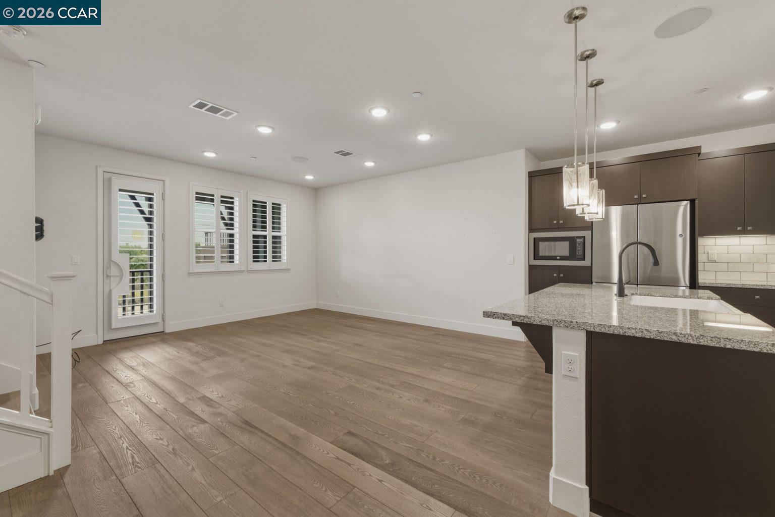 2737 5th Street Alameda, CA 94501 - Photo 10 of 37 a view of a kitchen center island with wooden floor