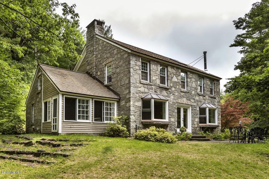 635 Reservoir Road Otis, MA 01029 - Photo 1 of 30 a front view of a house with a yard