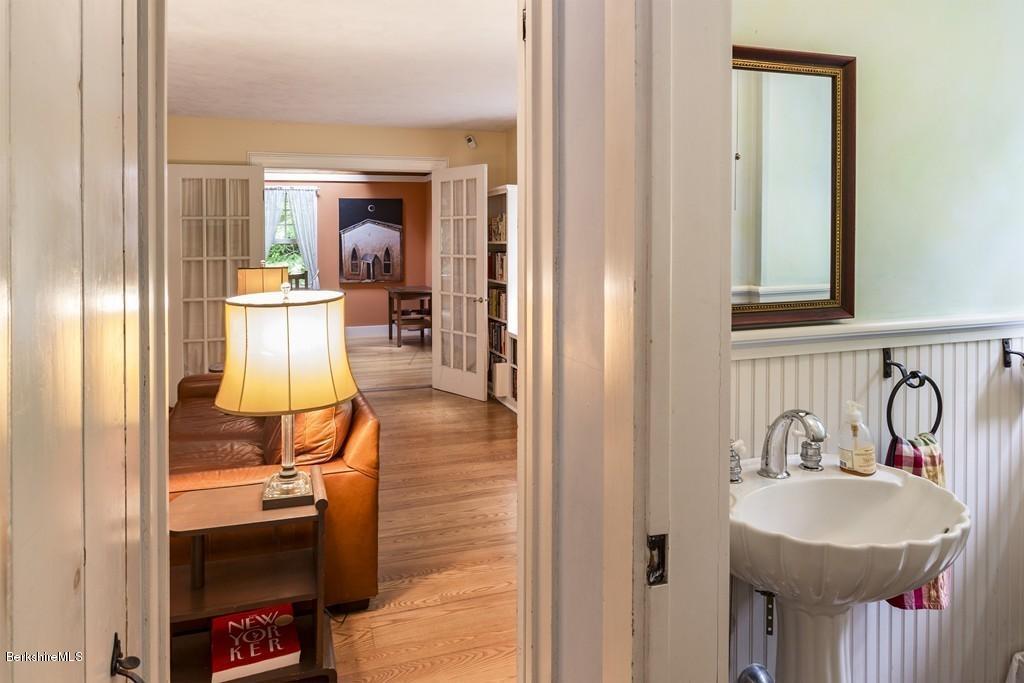 635 Reservoir Road Otis, MA 01029 - Photo 11 of 30 a en suite bathroom with a sink and a mirror
