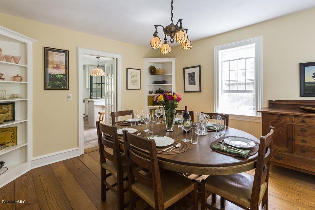 635 Reservoir Road Otis, MA 01029 - Photo 13 of 30 a view of a dining room with furniture window and wooden floor