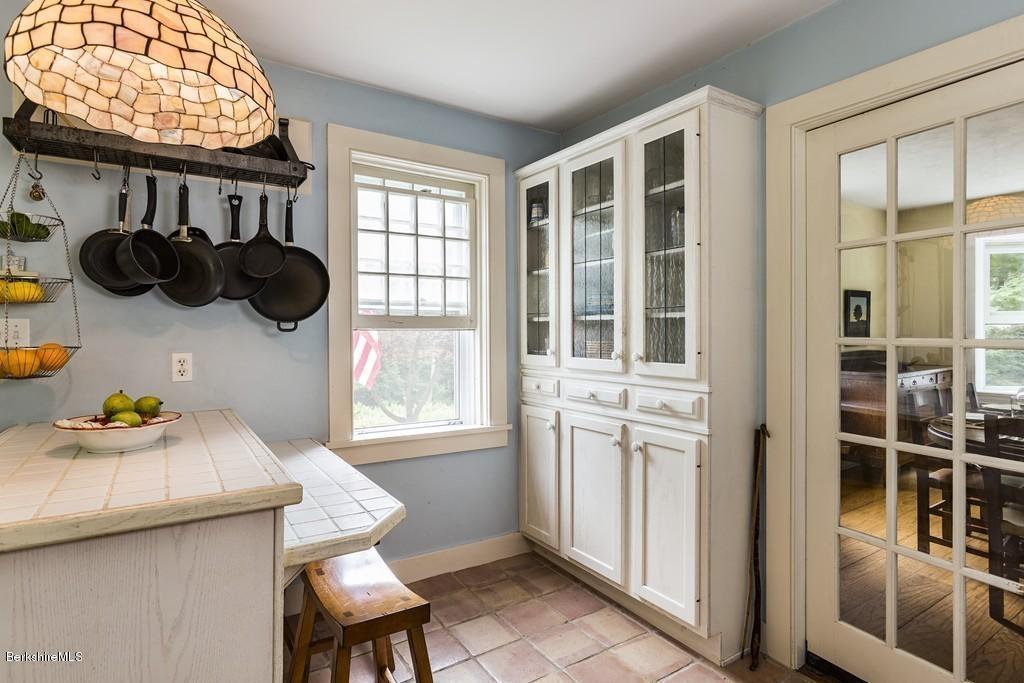 635 Reservoir Road Otis, MA 01029 - Photo 17 of 30 a table and a chair in a room with a window