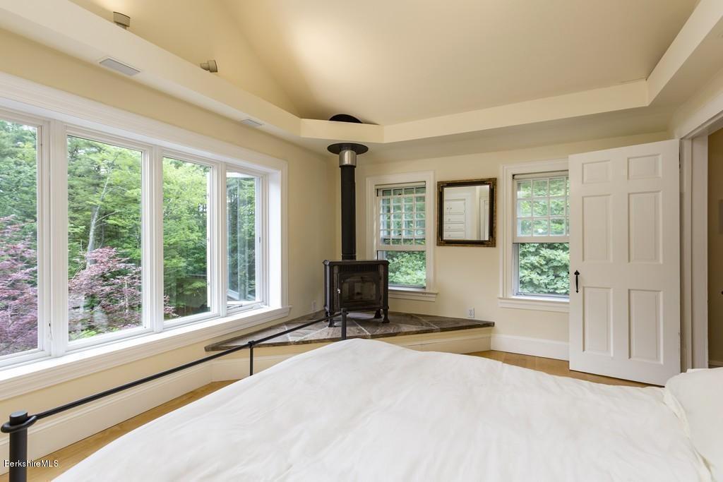 635 Reservoir Road Otis, MA 01029 - Photo 20 of 30 a bedroom with furniture and windows