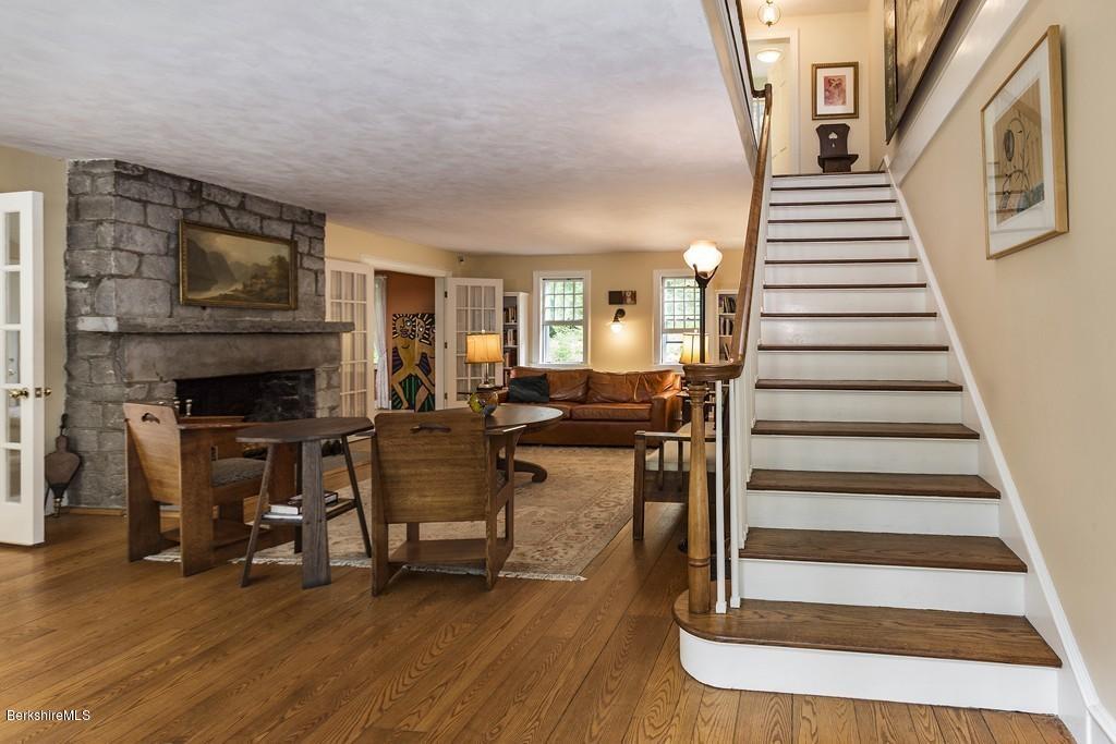 635 Reservoir Road Otis, MA 01029 - Photo 3 of 30 a view of a livingroom with furniture and staircase
