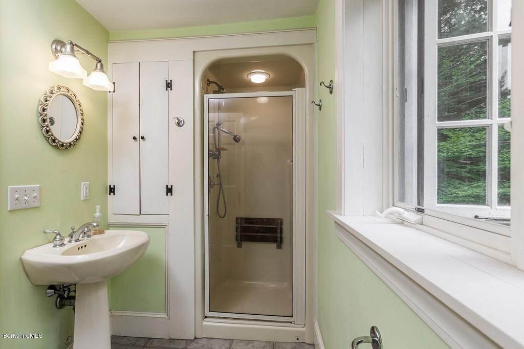 635 Reservoir Road Otis, MA 01029 - Photo 26 of 30 a bathroom with a sink and a mirror