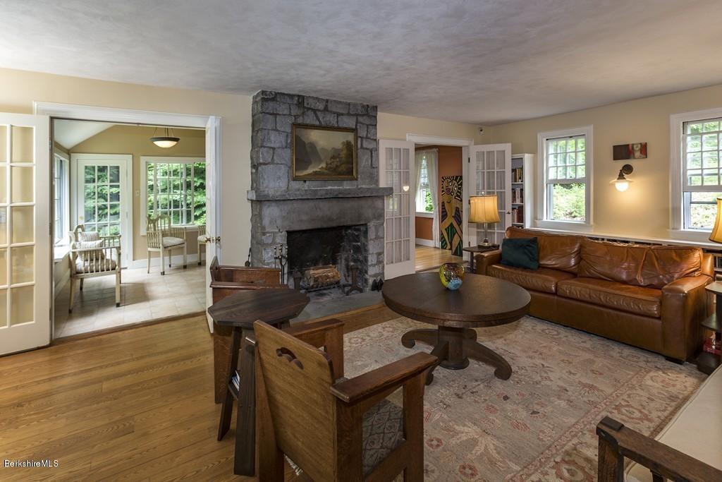 635 Reservoir Road Otis, MA 01029 - Photo 6 of 30 a living room with furniture and a fireplace