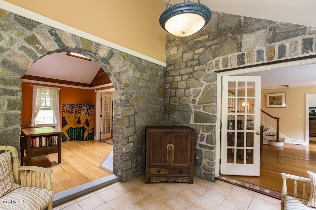 635 Reservoir Road Otis, MA 01029 - Photo 8 of 30 a view of a balcony with furniture and a potted plant