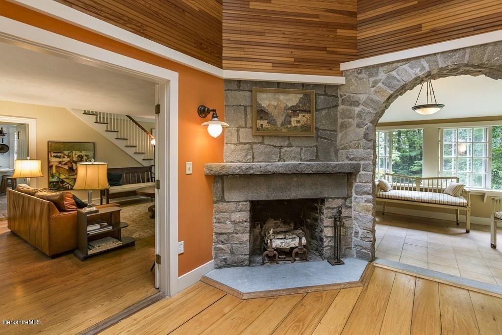 635 Reservoir Road Otis, MA 01029 - Photo 10 of 30 a living room with furniture and a fireplace